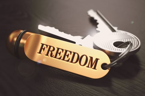 Keys to Freedom - Concept on Golden Keychain over Black Wooden Background. Closeup View, Selective Focus, 3D Render. Toned Image.